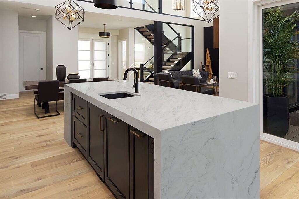 Kitchen island with marble waterfall countertop edge